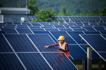 Engineers or workers are inspecting solar panels, engineers and solar power generation stations. © CStock