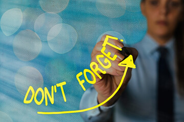 Writing note showing Don T Forget. Business concept for used to remind someone about an important...