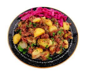 Corned beef hash meal with pickled red cabbage isolated on a white background