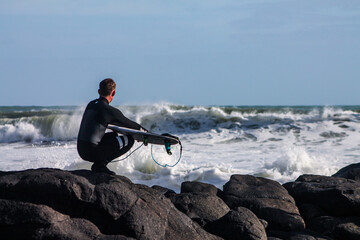 surfer watching the waves