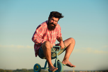 Funny crazy man bicyclist riding a bike.