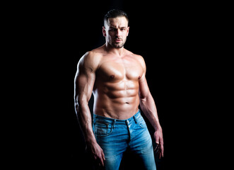 Fototapeta na wymiar Strong man showing his perfect naked body. Bare torso.