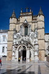 Naklejka premium Coimbra, Portugal, August 13, 2018: Facade of the church of Santa Cruz, located in the Plaza 8 de. Mayo in the old part of the city. vertical