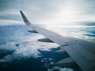 flying and traveling, view from airplane window on the wing