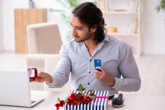 Successful young man doing marriage proposal via internet