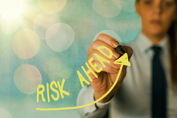 Writing note showing Risk Ahead. Business concept for A probability or threat of damage, injury,...