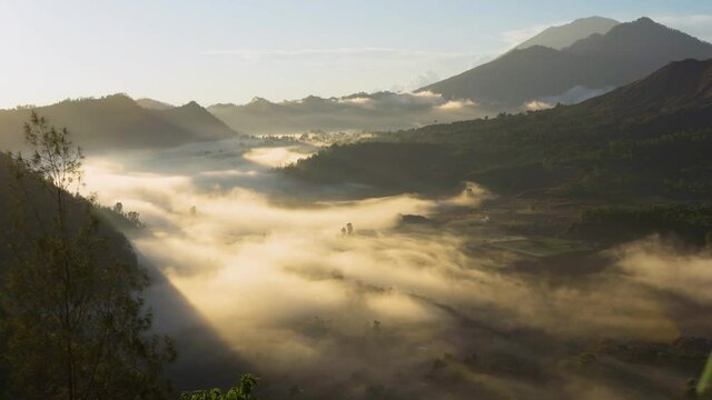 Aerial view of misty Pinggan village at sunrise