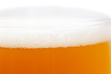 Mug of foamy beer isolated on white background.