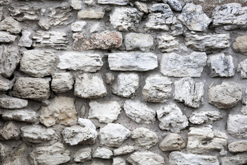 Stones in the wall of the house as an abstract background.