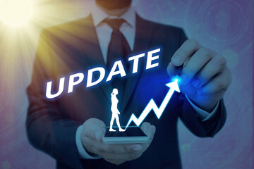 Writing note showing Update. Business concept for by adding Up to date information or making...