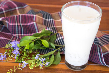 soybean milks healthy drinks with cloth and flower on table