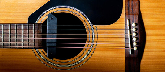 Fototapeta premium Close up sound hole and bridge acoustic guitar