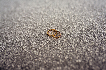 wedding gold rings in a beautiful composition lie beautifully