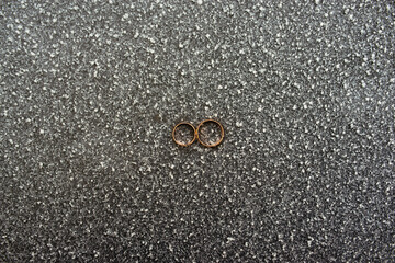 wedding gold rings in a beautiful composition lie beautifully