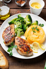 Grilled Chicken breast or fillet served with mashed sweet potato and stir fry broccoli. Healthy diet menu for lunch.