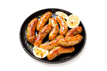 Homemade chicken sausages fried and stewed in garlic butter sauce. isolated on white background	