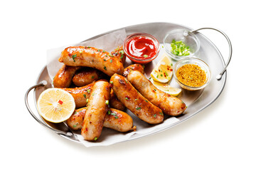 Homemade chicken sausages fried and stewed in garlic butter sauce. isolated on white background	
