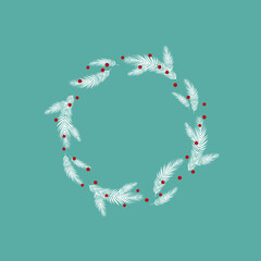 Wreath from white spruce branches and red berries on blue winter sky.