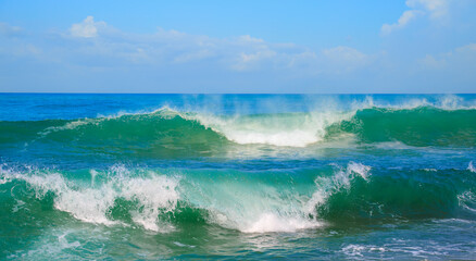 Power double sea wave breaking on the shore