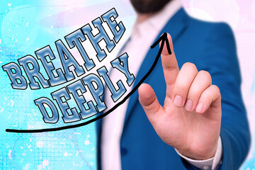 Conceptual hand writing showing Breathe Deeply. Concept meaning to take a lot of air into the lungs...