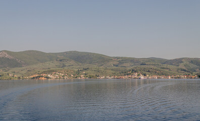 Evia island, Greece - June 28. 2020: Panorama approaching the island of Edipsos
