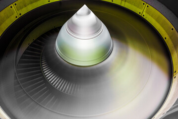 running jet engine turbine with fast turning fan blades - close-up