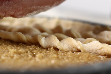 Twist strips into spirals and arrange on top of filling. Making Shoofly Tart Series.