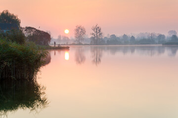 Naklejka na ściany i meble early morning before sunrise over the lake
