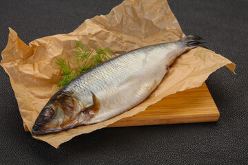 Salted herring over the wooden board