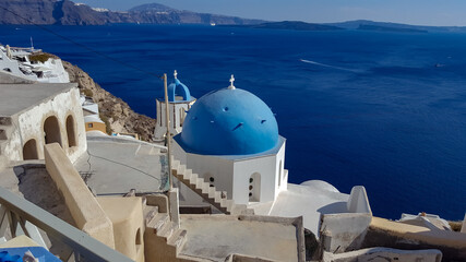 sunset on the island of santorini in the month of september surrounded by white houses