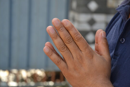 hands of a person doing 'Namaste'