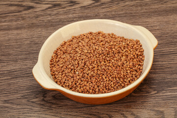 Raw buсkwheat cereal in the bowl