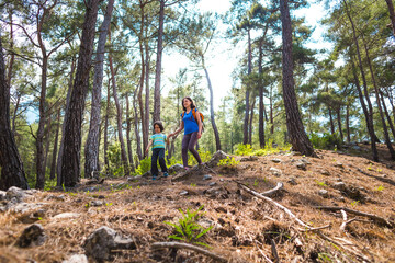 Naklejka premium A child with his mother go hiking.