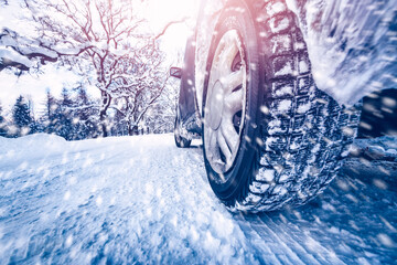 Car tires on winter road covered with snow © candy1812