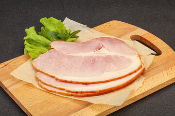 Sliced pork belly over board