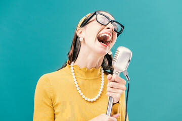 Vintage style woman singing with a microphone