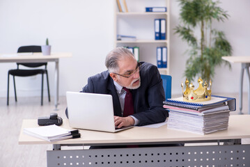 Old king businessman employee at workplace