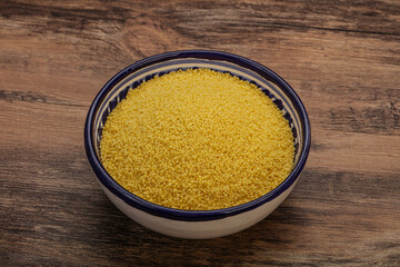 Raw cous cous heap in the bowl