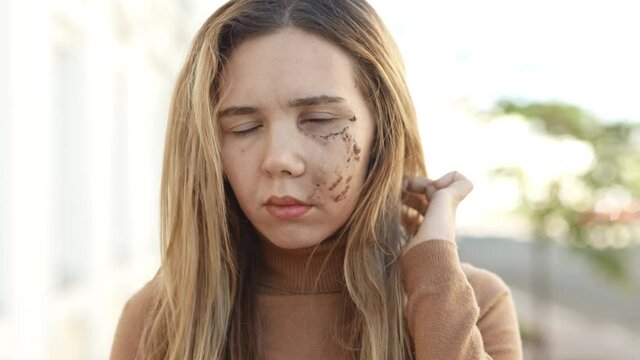 Young woman portrait with scar on her face. Home violence victim. Scared girl in despair shaming of her wound looking around for help. Abusive family relationship and crime concept. Social problem.