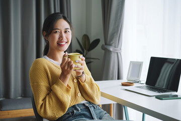 Beautiful asian businesswoman working on laptop computer at home office. Working at home concept