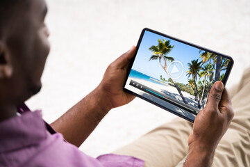 Young African Man Watching Video