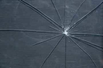 Pieces of broken glass standing on black background