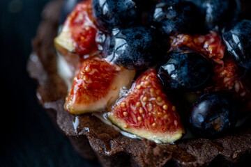 shortbread with fresh figs on a dark surface