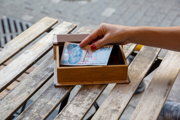 Woman paying bill at the cafe