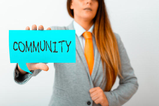 Conceptual hand writing showing Community. Concept meaning group of showing with a common characteristics living together Displaying different color notes for emphasizing content