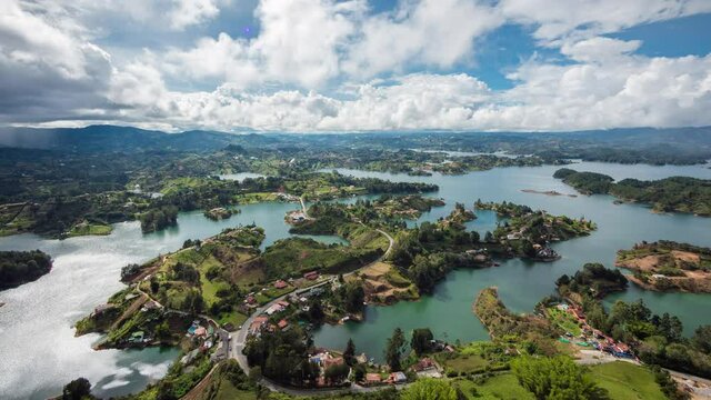 Daytime time lapse view of dramatic skies over the Guatape Reservoir near Medellin, Antioquia Department, Colombia.