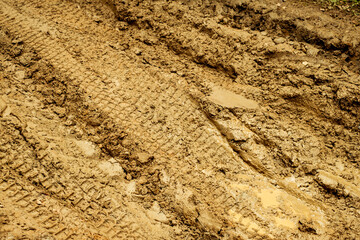 traces of cars in the mud