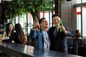 Executive business people greeting and meeting with partner or friends, alcohol drink hang out party and smile cheers together after work