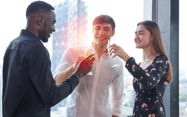 Young teen business people enjoy party celebration and talking with friends or coworker and relax drinking win or champagne on roof top building