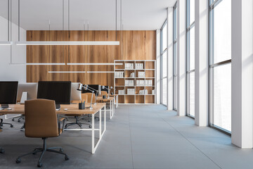 Open space office, wooden desks with computers